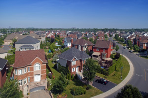 Aerial view on neighbourhood pool and houses